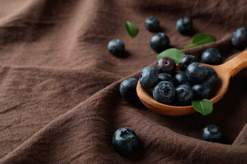 Fresh berry concept with blueberry on kitchen towel background