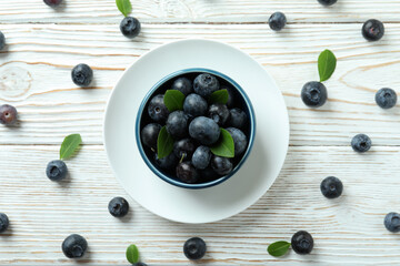 Fresh berry concept with blueberry on white wooden table