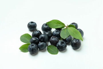Fresh blueberry with leaves on white background
