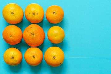 Oranges fruit on colored paper background