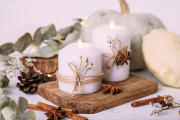 Autumn composition with pumpkin and candles. Beautiful autumn decor