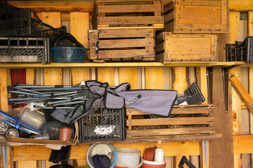 various old inventory of a country house on shelves in a barn.