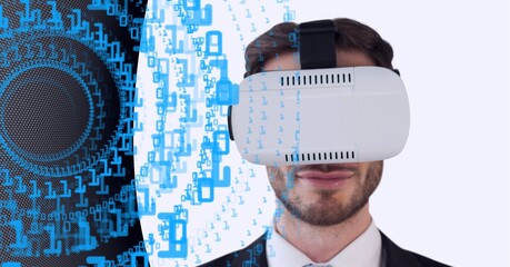 Binary coding data processing over businessman wearing vr headset against technology background