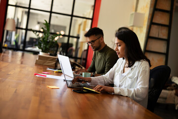 Colleagues drinking coffee in office. Businesswoman and businessman enjoying in fresh coffee while working..