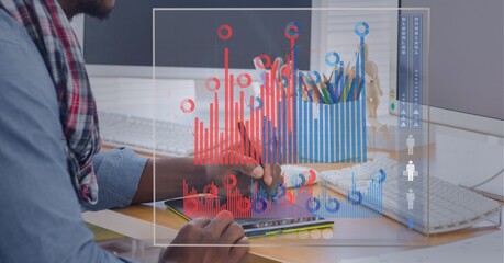 Digital interface with statistical data processing against mid section of man using graphic tablet