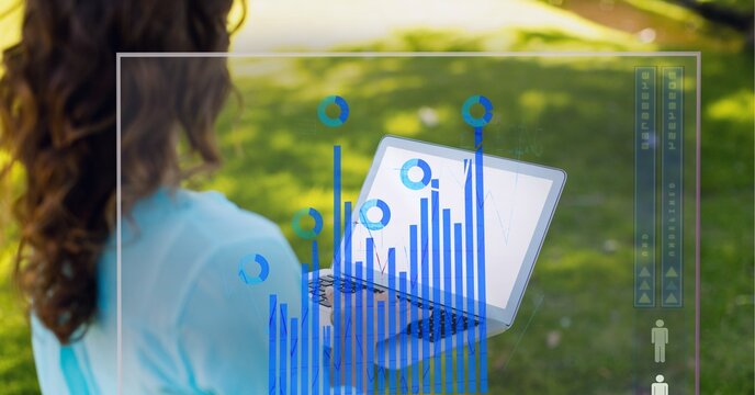 Digital interface with statistical data processing against woman using laptop in the garden