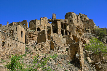 Abandoned village Gamsutl at the top of the mountain peak in the Caucasus, Russia