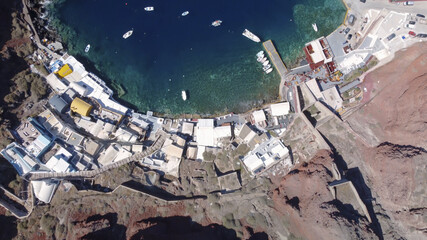 Aerial shot of the Aegean Sea and Oia village on Santorini, Greece