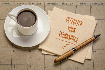 declutter your workspace motivational reminder - handwriting on a napkin with a cup of coffee, productivity, business or lifestyle concept