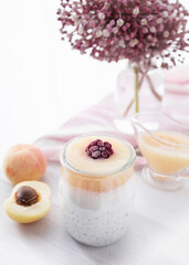 Kefir with homemade apricot and raspberry jam. Yogurt pudding with chia seeds and homemade apricot jam. Homemade and healthy desserts. Food photography