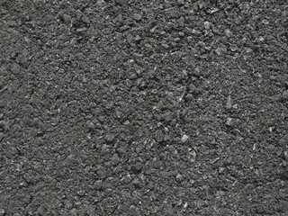 Texture of black street asphalt close-up background.