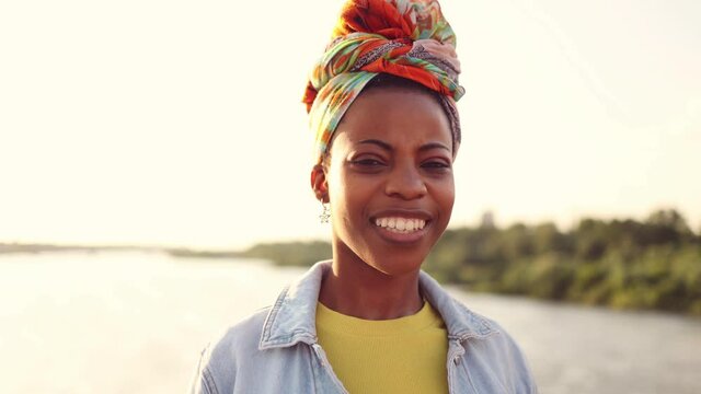 Young woman smiling at sunset

