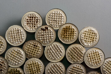 Colored and used coffee capsules in close-up.
