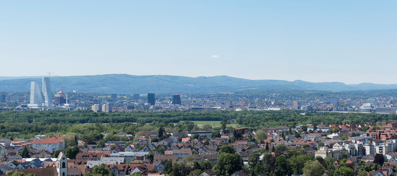 Panoramic view from Tullingen hill in L&ouml;rrach. Trinationale agglomeration Basel with Roche Tower in Switzerland und Weil am Rhein in Germany. Jura and Sundgau mountains in the background