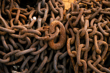 rusty steel chains from a fishing boat up close