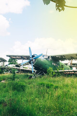 Fototapeta premium A close-up of an old wrecked passenger plane that has been decommissioned and stands for tourists. The fuselage shows traces of rust and chips. Parts of the metal structure are visible on the wings