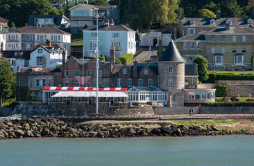 Cowes, Isle of Wight, England, UK. 2021. An exterior view of the prestigious Royal Yacht Squadron clubhouse and Castle at West Cowes, Isle of Wight, UK - obrazy, fototapety, plakaty