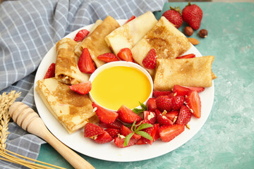 Pancakes, thin pancakes with fresh strawberries. On an empty background. Copy space.
