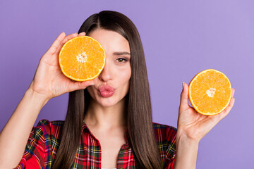 Photo of flirty long hairdo millennial lady hold fruits wear red shirt isolated on violet color background