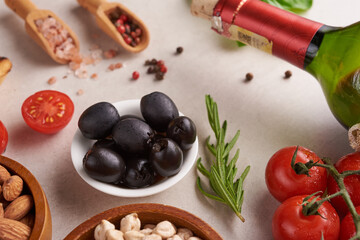 Healthy food. Vegetables, lemon and chickpeas on concrete background, Vegetarian food or Mediterranean cuisine concept, copy space. Fruit, vegetables, grain, nuts olive oil on wooden table.