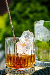 Fototapeta na wymiar A glass of whiskey with ice.