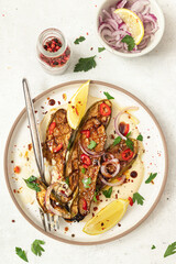 Grilled zucchini with sauce and tahini