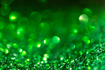 Green glitter vintage lights background defocused for festivals and celebrations
