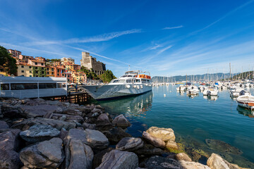 Port of Lerici town with many boats and the Ancient Castle (1152-1555). Tourist resort on the coast of the Mediterranean sea (Ligurian Sea), Gulf of La Spezia, Italy, Europe.