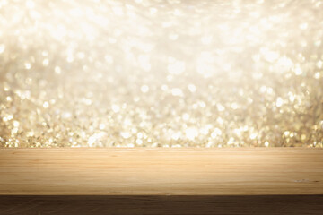  Gold color bright lights bokeh background of wooden table in front of lights abstract blurred and space use for product