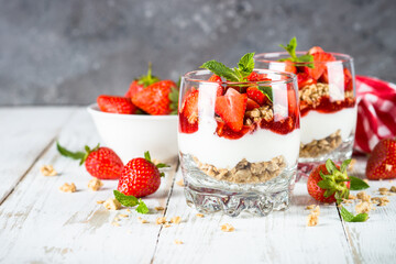 Greek yogurt with fresh strawberry and granola. Parfait.