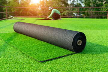 Roll of astroturf or field turf matting of artificial grass soccer field,green lawn background with...
