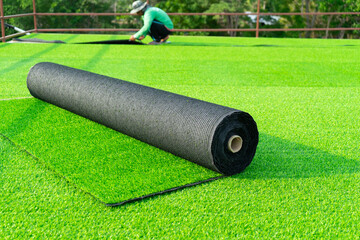 Roll of astroturf or field turf matting of artificial grass soccer field,green lawn background with...