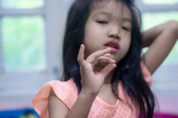 A 5-year-old Asian girl broke her first tooth.