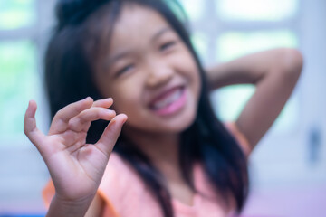 A 5-year-old Asian girl broke her first tooth.