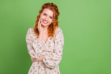 Photo of lovely curly hairdo young lady hand face wear blouse isolated on pastel green color background