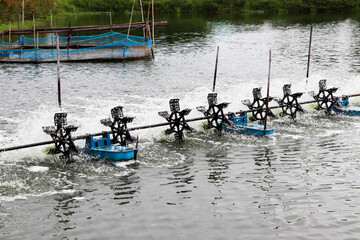 Water turbine is spinning for increasing oxygen in the water. © angei535