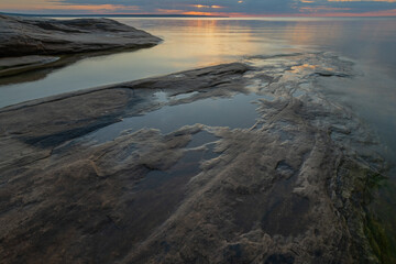 Landscape at sunset of the rocky shoreline of Lake Superior at Miner's Beach, Michigan's Upper Peninsula, USA