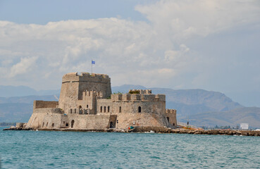 Fototapeta na wymiar The water castle of Bourtzi is a Venetian castle located in the middle of the harbour of Nafplio. (aka Nauplia, Nafplion)