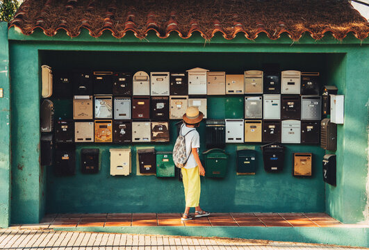 A girl near the mailboxes.
