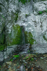 Strait valley with Rotschbach creek and Kesselfall waterfall without water