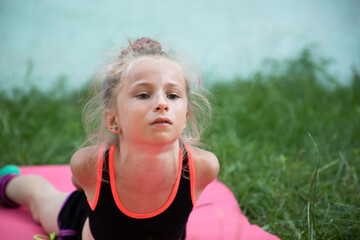 Girl gymnast doing workout outdoors