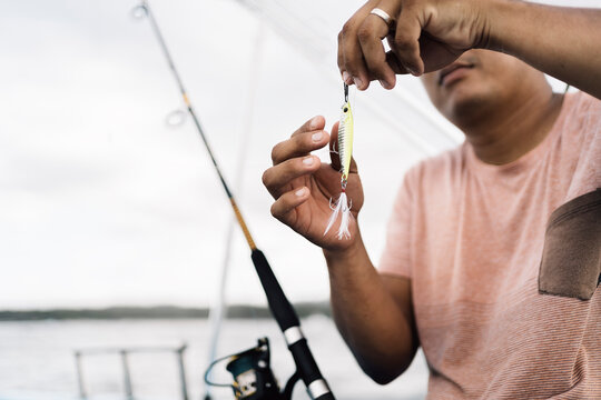 Fisherman Holding Fishing Bait