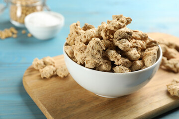 Dried soy meat on light blue wooden table, closeup