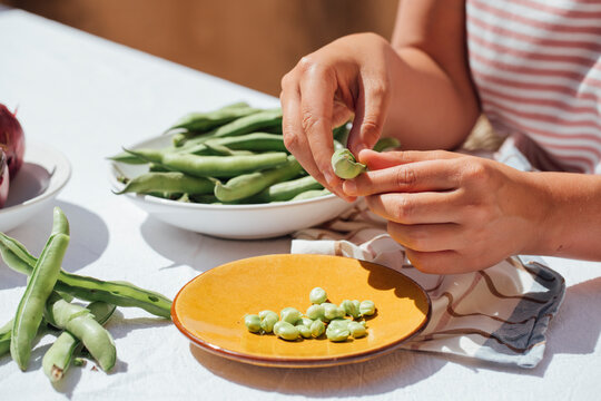 Peeling peas 