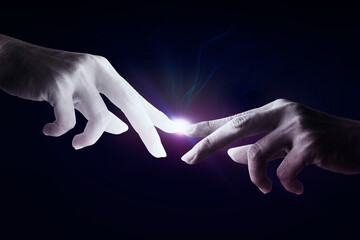Human hand touching an cyborg finger about to touch human finger on dark background - Futuristic...