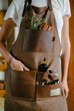 Portrait of a woman in a leather apron