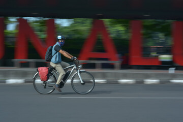 person riding a bicycle in road