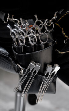 Close-up of neatly laid barber tools in barber's tool pocket