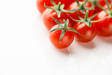 cherry tomatoes part on white background