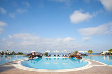Fototapeta premium Beautiful landscape with blue sky and swimming pool at resort